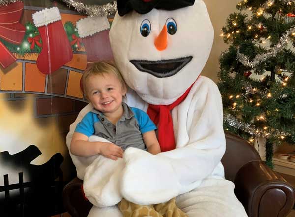 Child with Frosty the Snowman